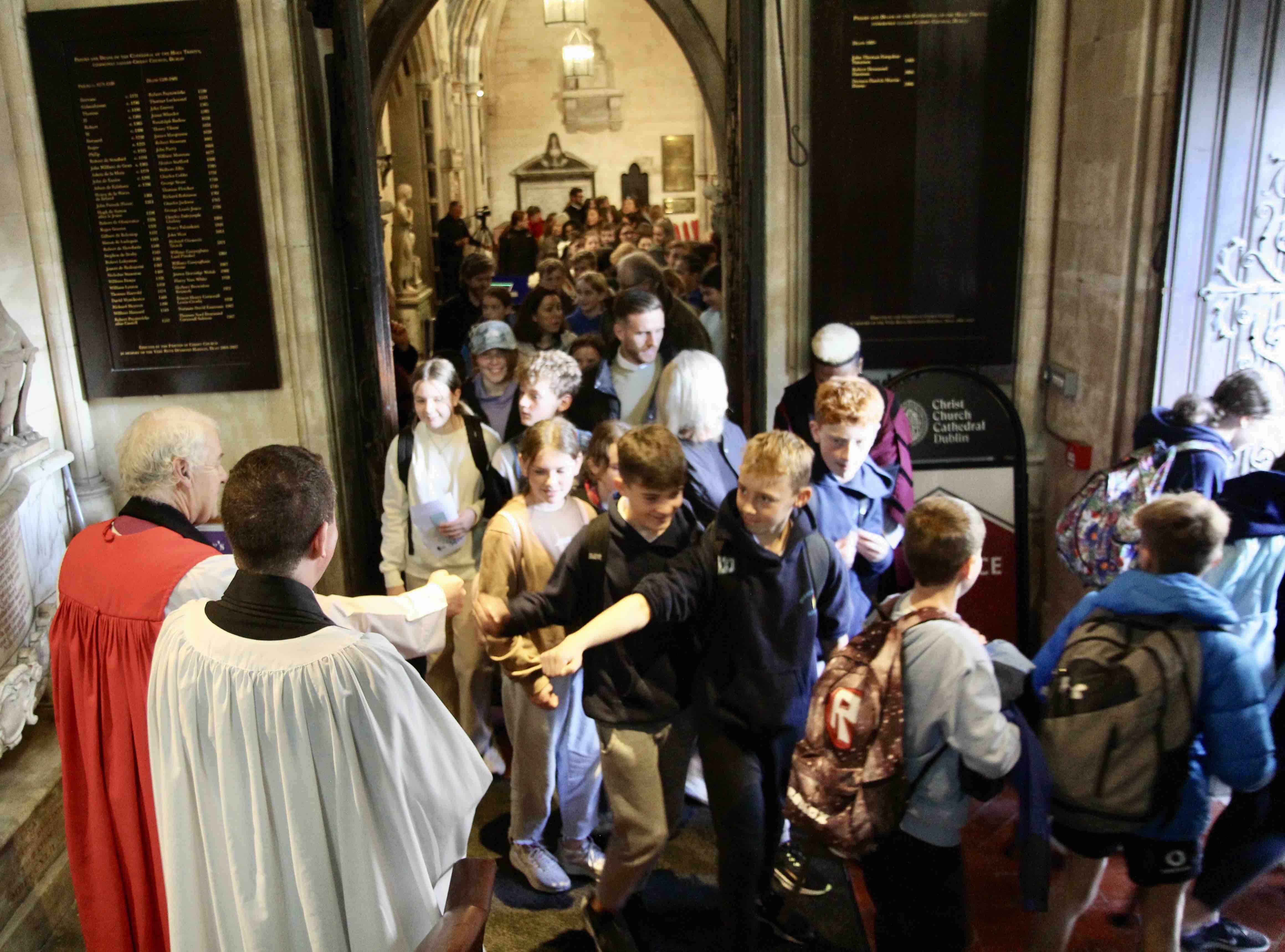 Children greet the Archbishop and the Revd Sean Hanily after the Diocesan Schools Service.