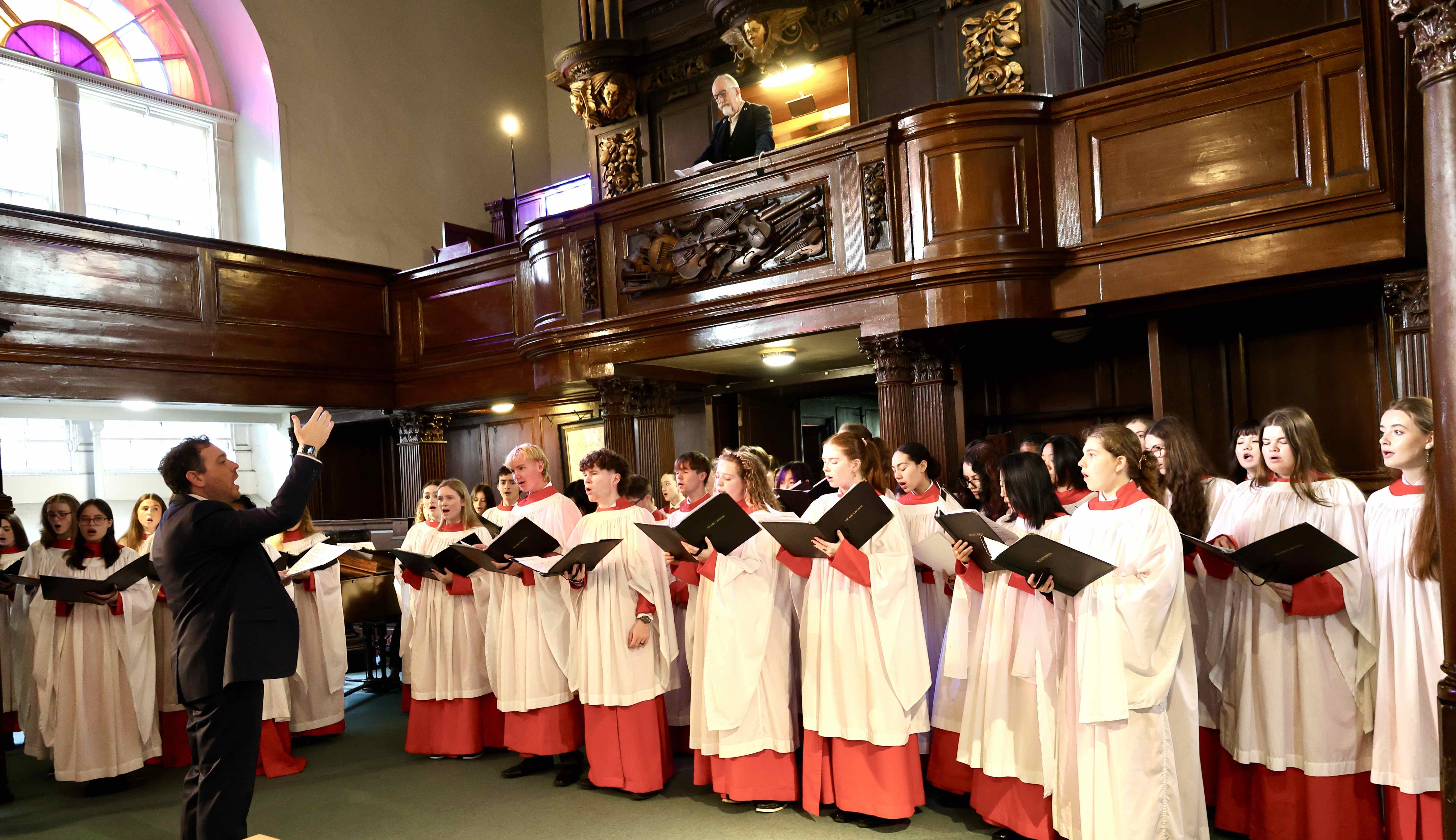 Ciaran Kelly directs the Choir of The King's Hosptal School at the start of the Law Service in St Michan's.