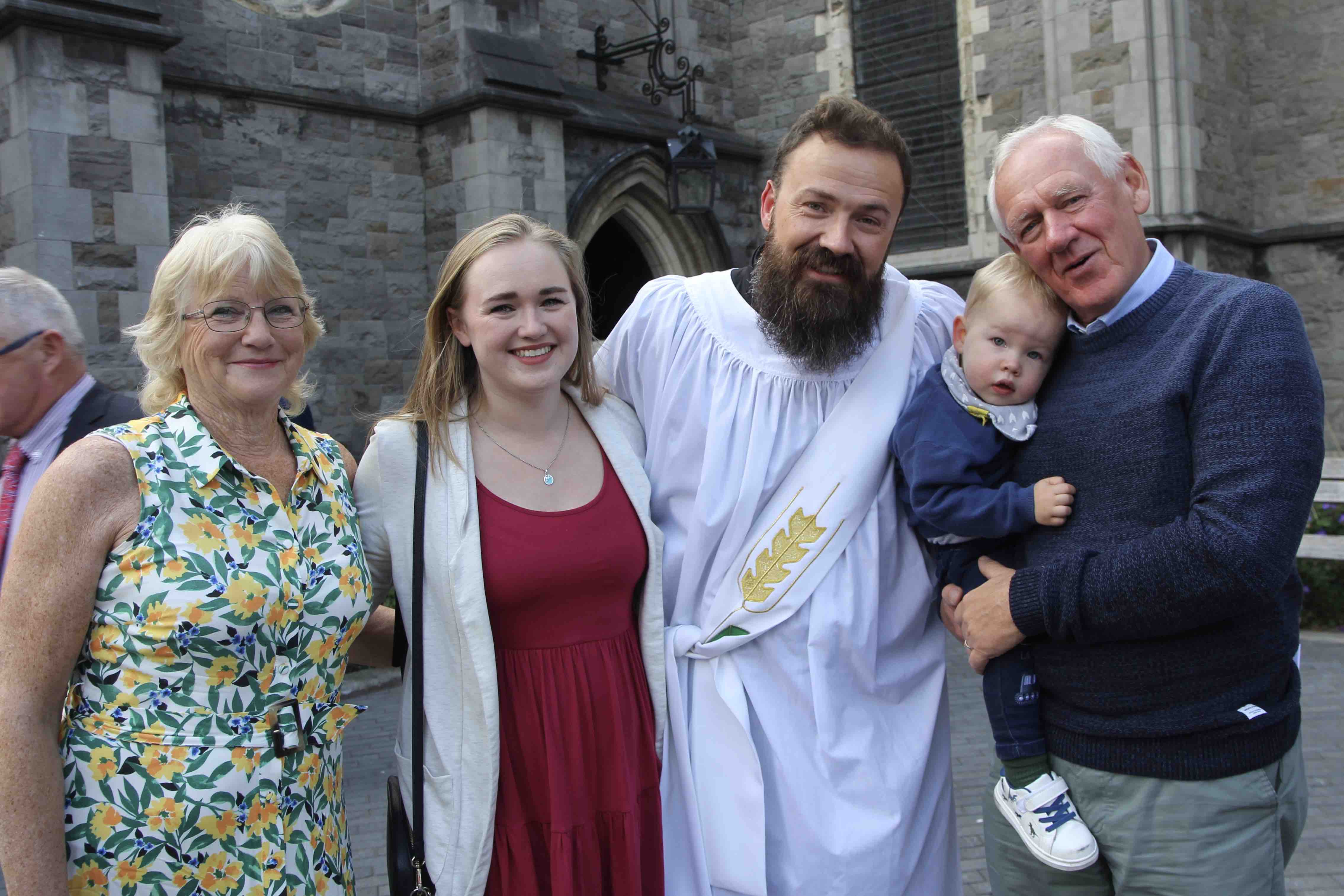 The Revd Scott Evans with his family after his ordination.