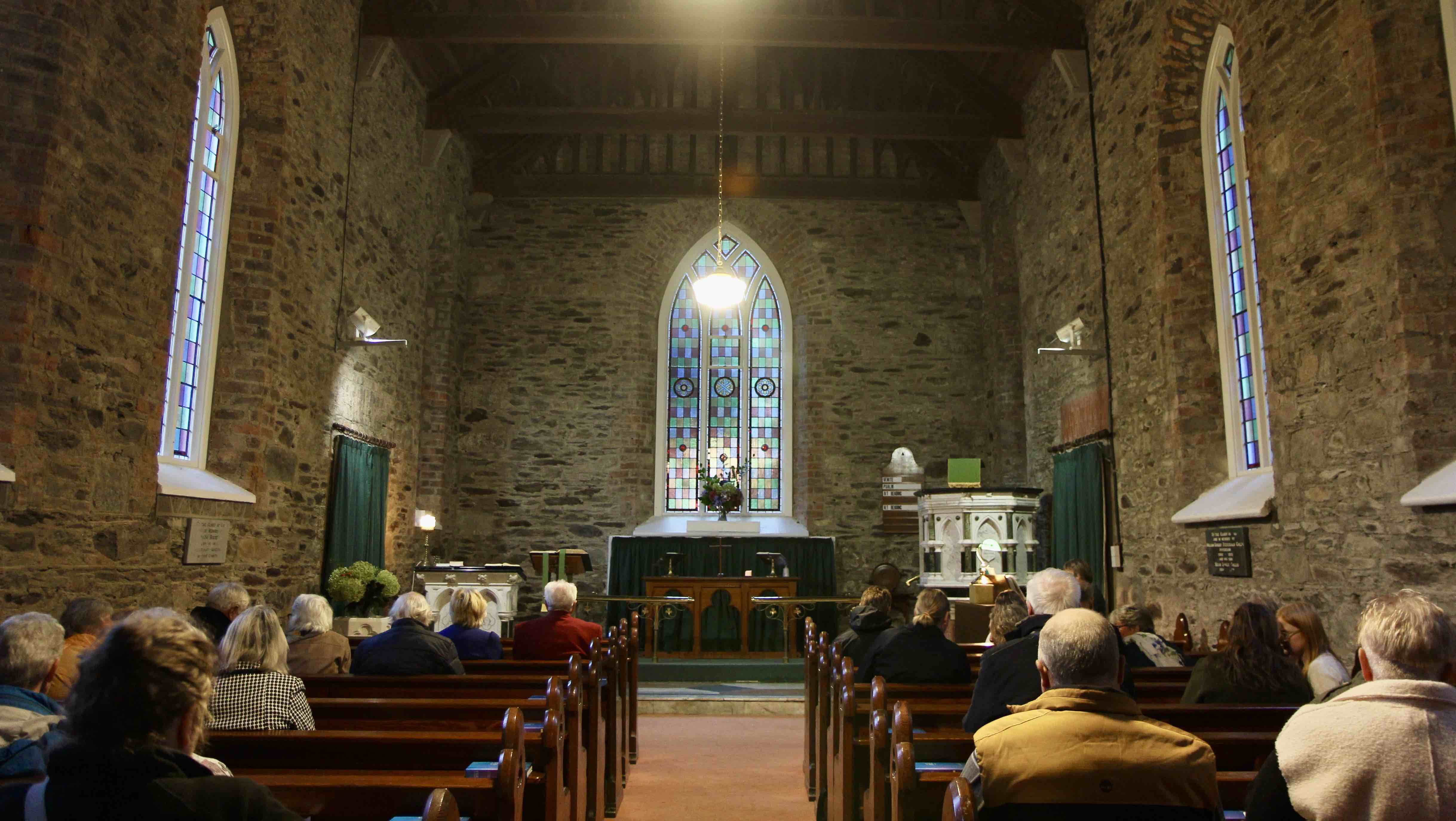 The newly restored windows of Calary Church before the service began.