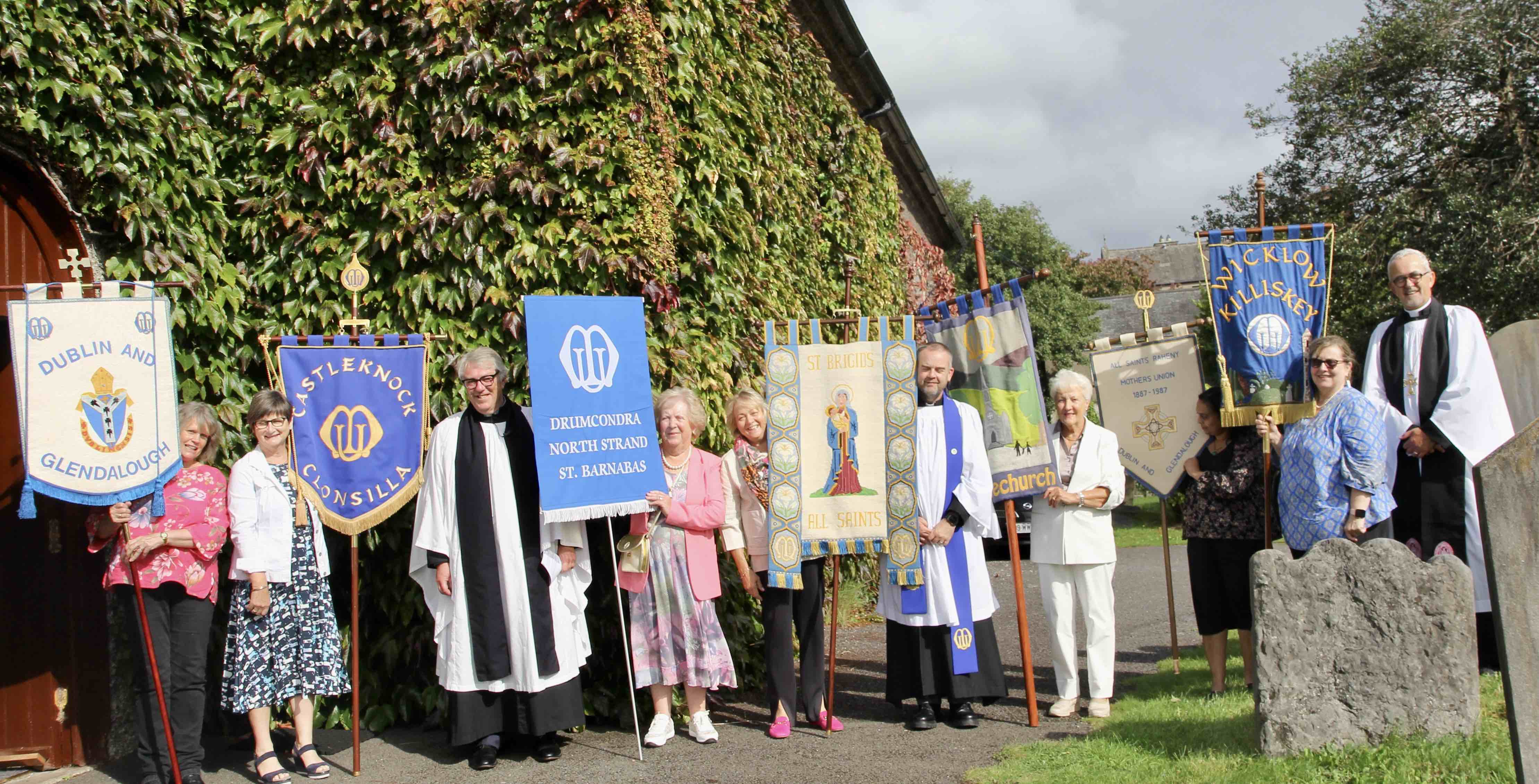 Clergy and banner bearers outside the Church of St John the Baptist in Drumcondra following the Diocesan MU Festival Service.