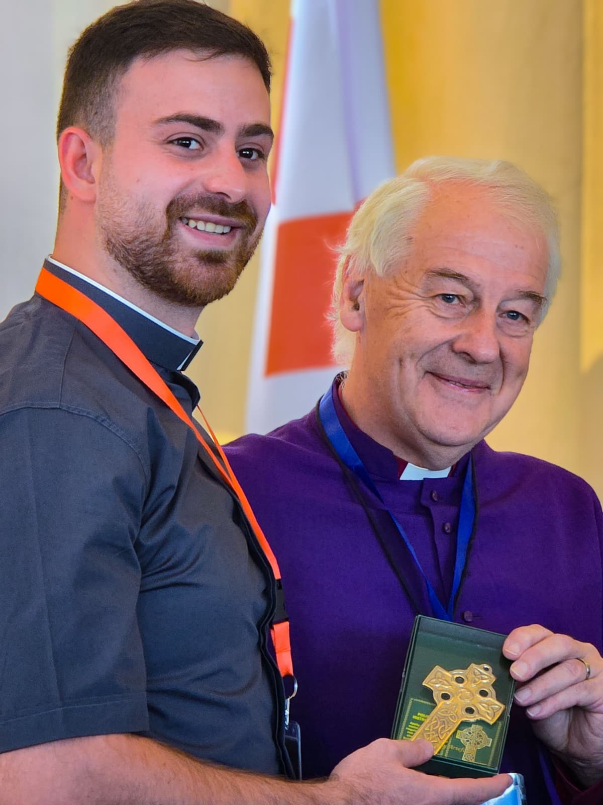 Archbishop Jackson presents a Celtic cross to the Revd Saba Kerry following his ordination as a Deacon.