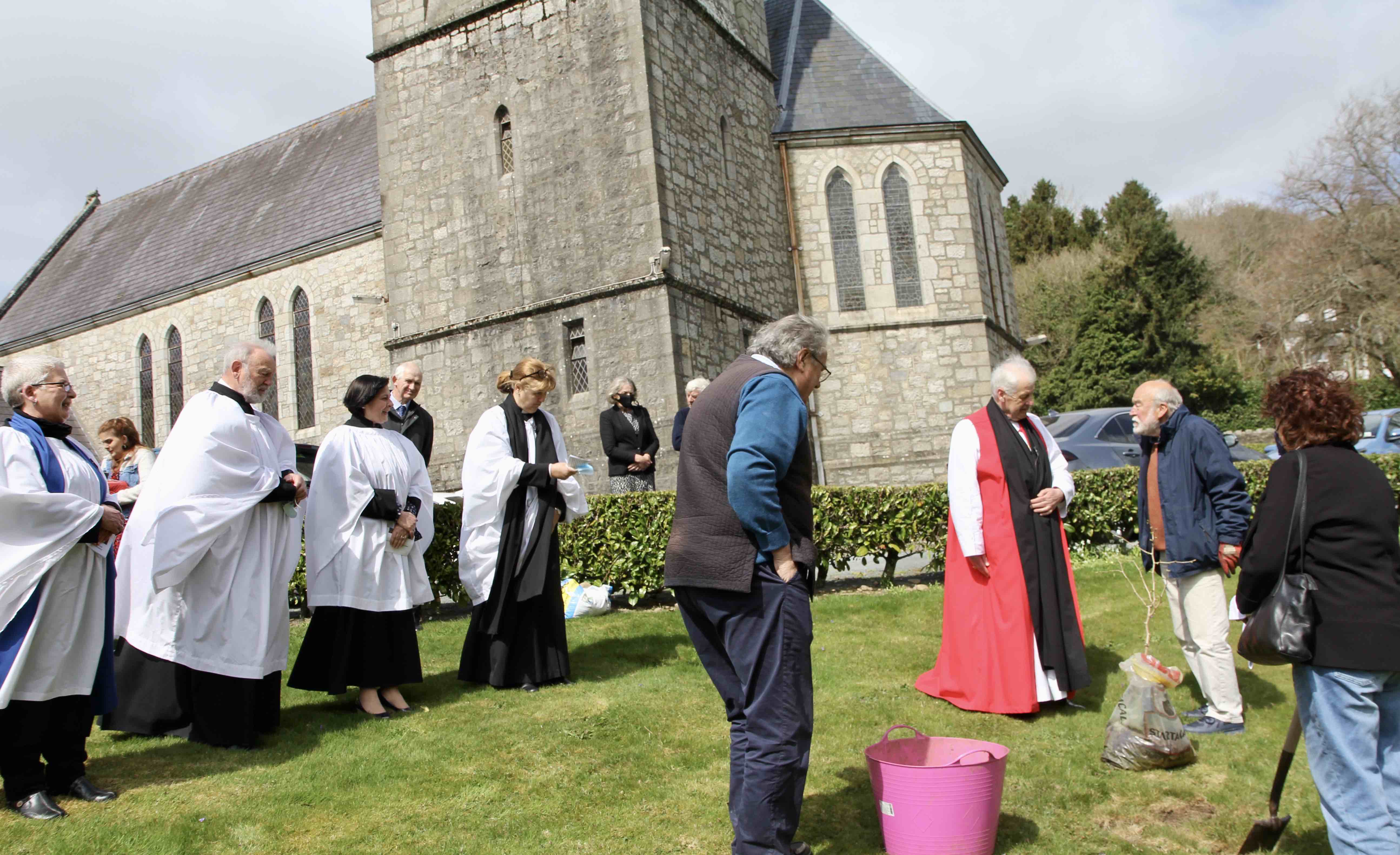 Preparing to plant the commemorative tree outside Castlemacadam Church.