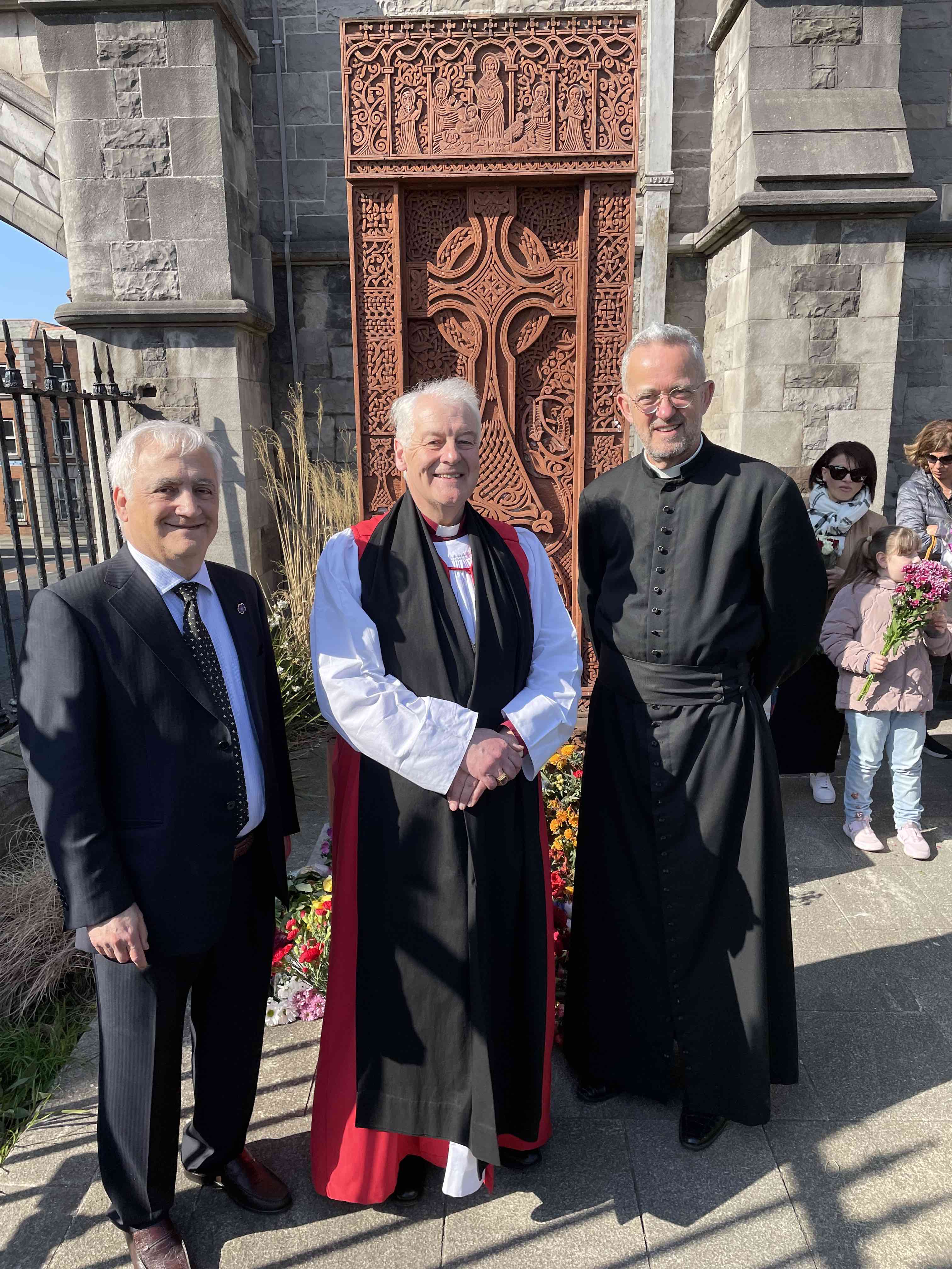 Armenian Honorary Consul Mr Ohan Yergainharsian, Archbishop Michael Jackson and Dean Dermot Dunne at the khachkar in the grounds of Christ Church Cathedral.